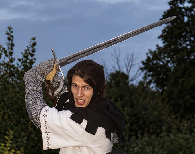 Mid-swing with a longsword during historical fencing practice